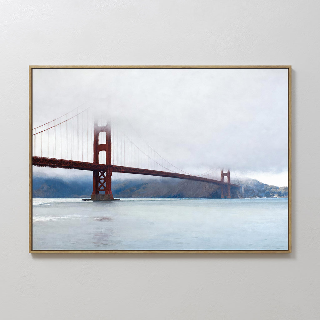The Crimson Passage Canvas Art - Horizontal features the Golden Gate Bridge shrouded in fog over calm waters with hills behind, bringing coastal elegance to any space when displayed on a white wall.