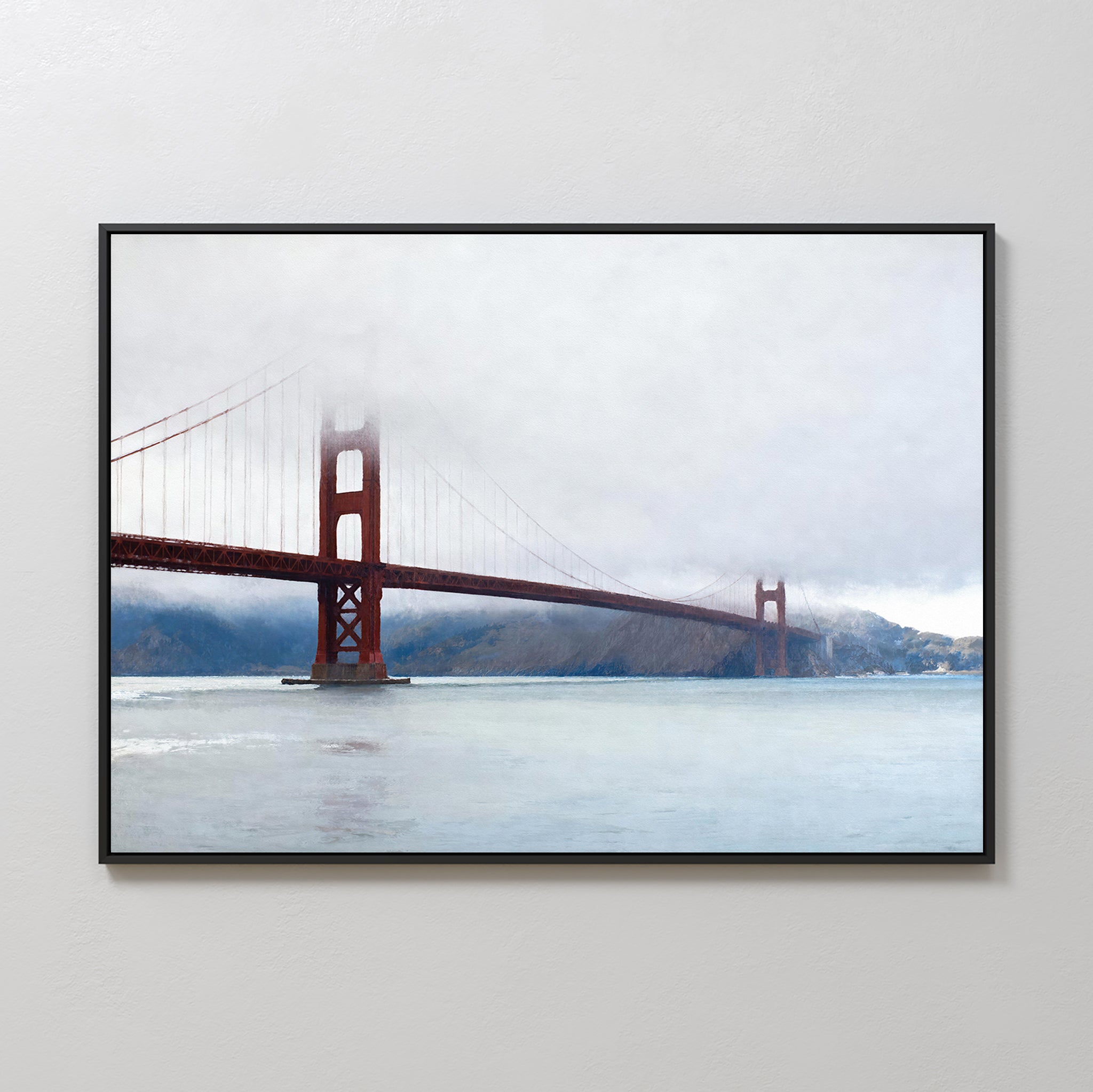 Crimson Passage Canvas Art - Horizontal: A framed canvas featuring the Golden Gate Bridge, its towers veiled in fog above calm waters and distant hills—adds refined coastal elegance to any light-colored wall.