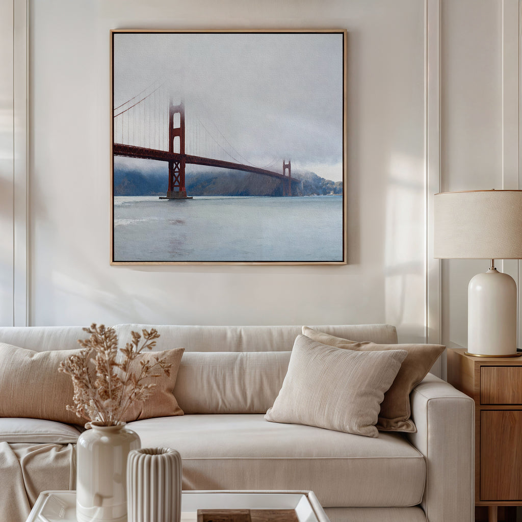 A beige, modern living room features a white sofa with neutral pillows, a lamp, and dried flowers in a vase. Above the sofa hangs the Crimson Passage Canvas Art - Square, bringing contemporary elegance to the serene space.