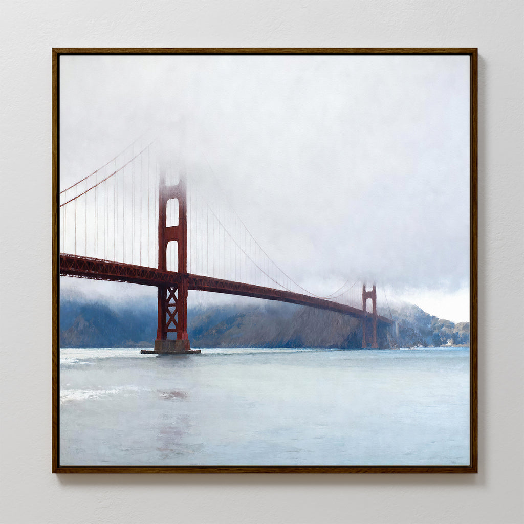 The Crimson Passage Canvas Art - Square captures coastal elegance, showcasing the Golden Gate Bridge’s red towers and cables as they fade into fog above serene, light blue water.