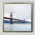 Add coastal elegance to any space with Crimson Passage Canvas Art - Square, showcasing the Golden Gate Bridge shrouded in fog above tranquil waters and distant hills.
