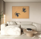 A modern living room with a light beige sectional, low wooden coffee table, tall floor lamp, potted plant, and the Dancing Leaves Canvas Art - Horizontal featuring blue and green leaves adds a Nordic Park-inspired touch to the space.
