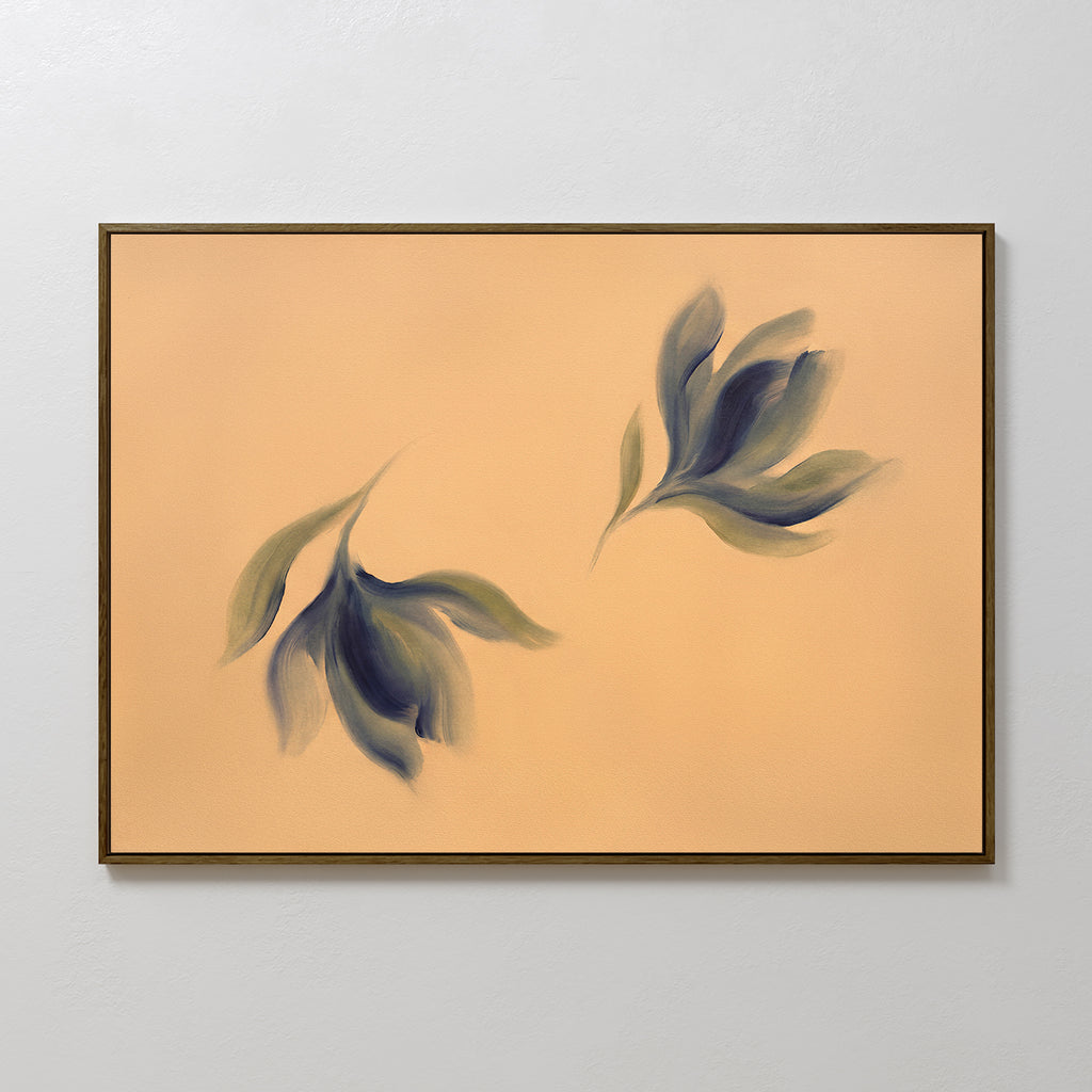 The Dancing Leaves Canvas Art - Horizontal displays two abstract, soft-edged leaf shapes in green and blue on a peach background, adding botanical charm to a light gray wall.