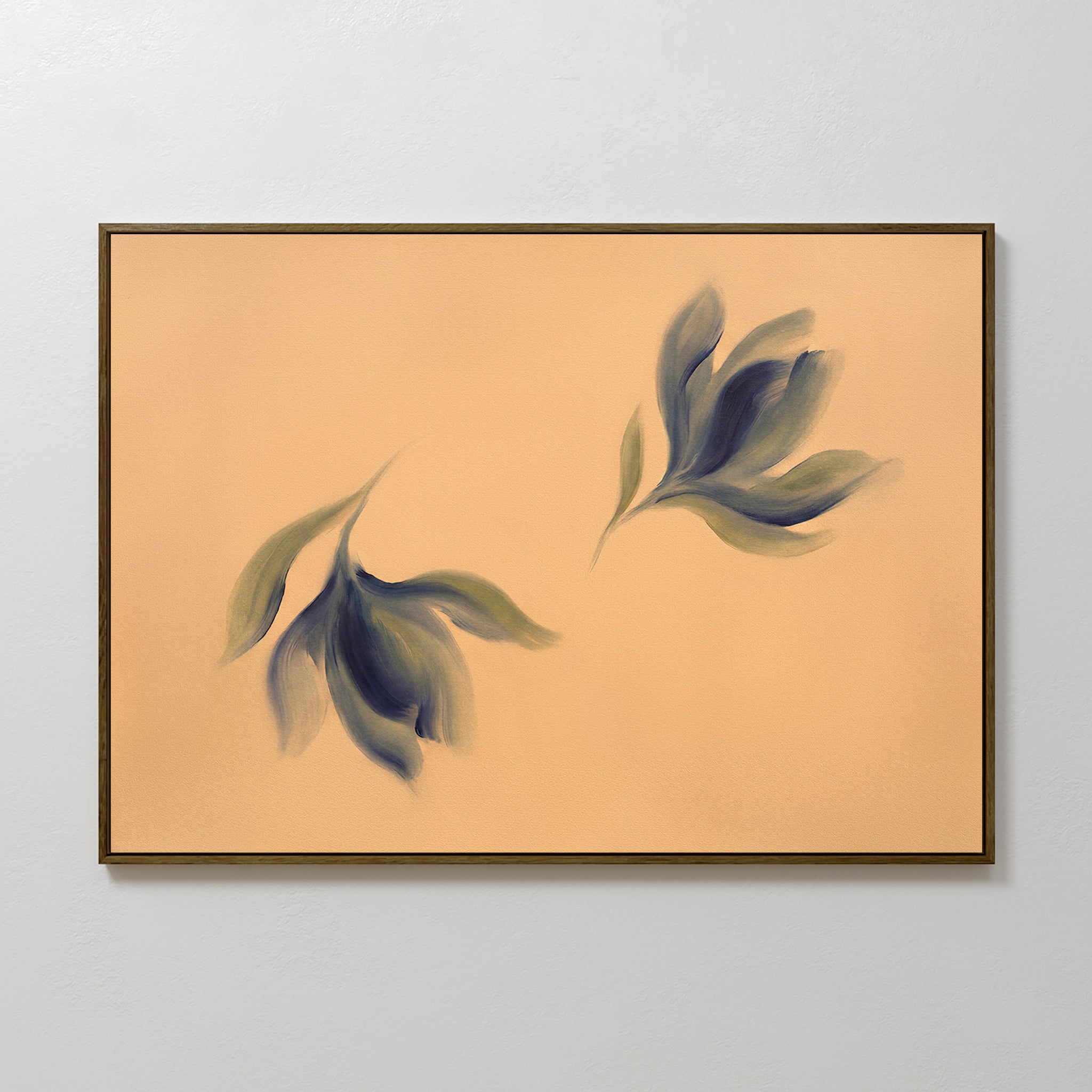 The Dancing Leaves Canvas Art - Horizontal displays two abstract, soft-edged leaf shapes in green and blue on a peach background, adding botanical charm to a light gray wall.