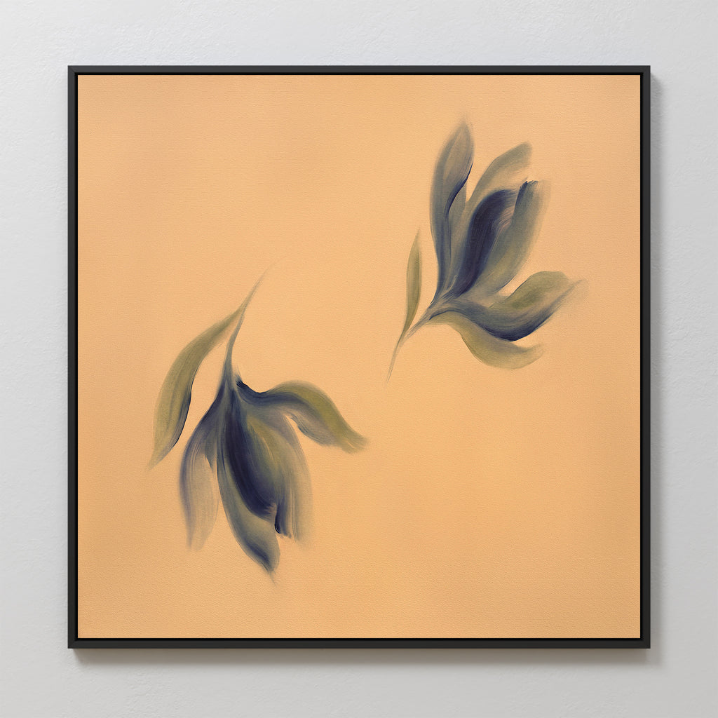 The "Dancing Leaves Canvas Art - Square" is a minimalistic canvas print with two abstract leaf shapes in green and blue on a beige background, framed in black—perfect for adding calm and simplicity to your space.