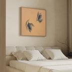 A modern, minimalist bedroom features a beige upholstered bed with white bedding. Above the bed hangs the Dancing Leaves Canvas Art - Square, a botanical print that adds Nordic Park charm and serenity to the space.