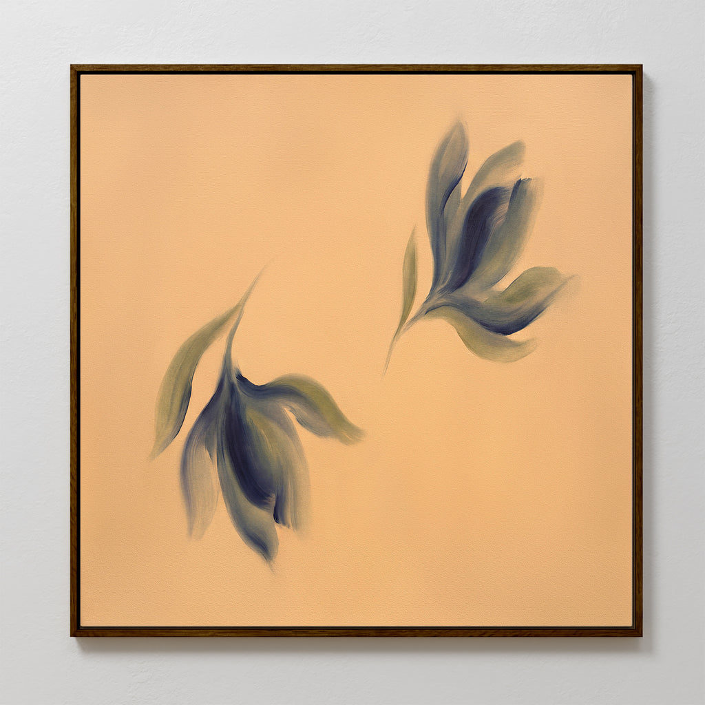 The Dancing Leaves Canvas Art - Square features two abstract blue-green leafy shapes on a peach background, set in a simple dark wood frame—perfect for adding a minimal Nordic Park vibe to your space.