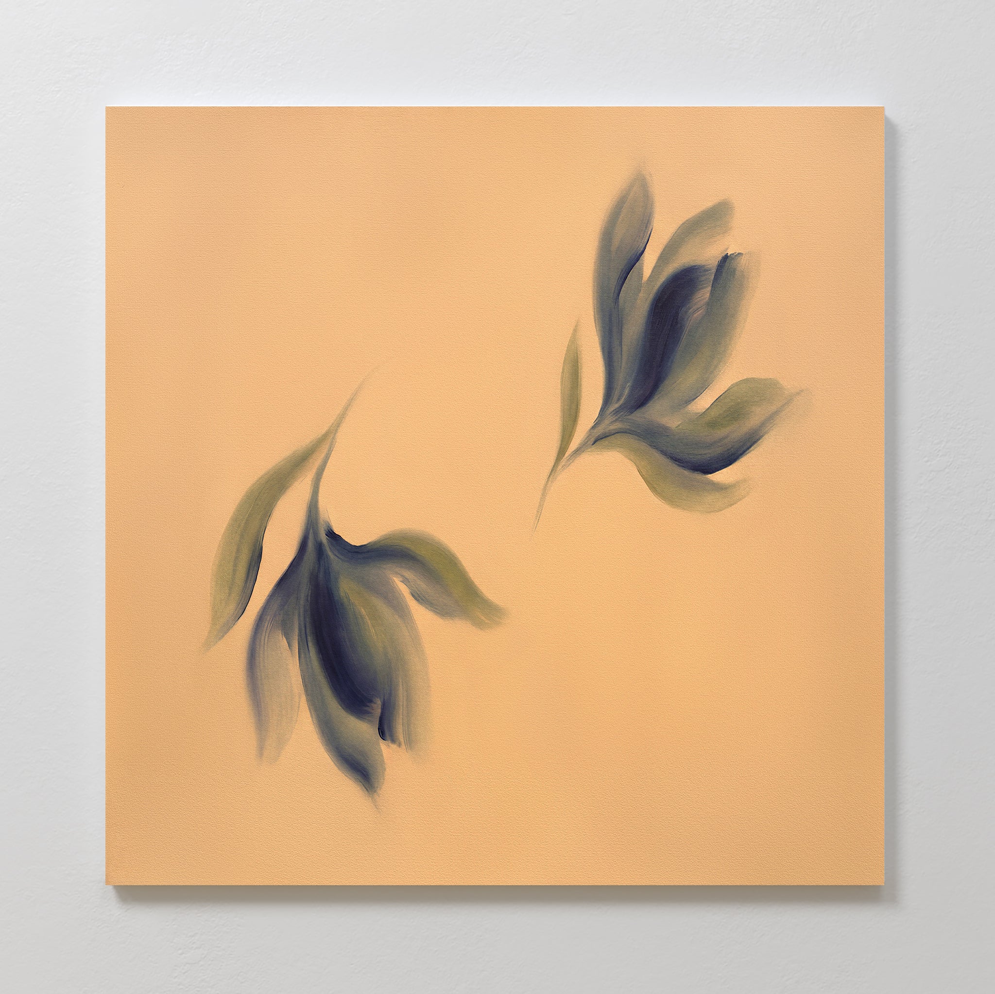 The Dancing Leaves Canvas Art - Square features two abstract greenish leaves with soft, blurred edges on a warm beige background, creating a calm and serene look—ideal as a canvas print for any Nordic Park-inspired space.
