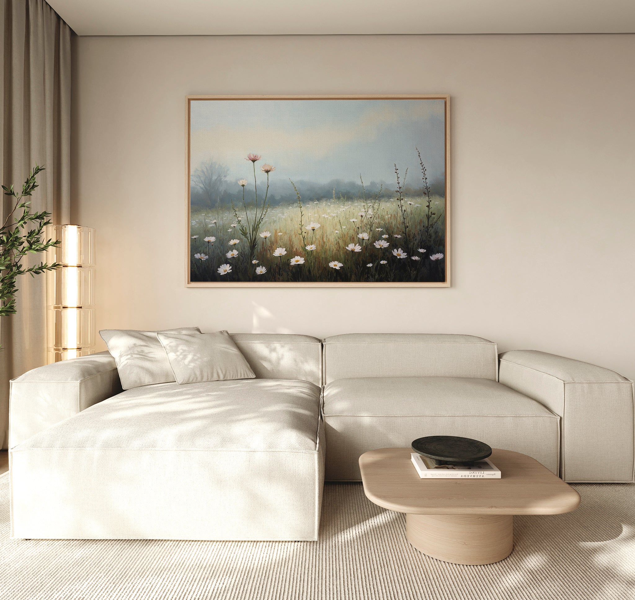 A modern living room features a beige sectional sofa, a light wood coffee table, and the Dawn Meadow Canvas Art - Horizontal displayed on a neutral wall, illuminated by soft natural light entering from the left.