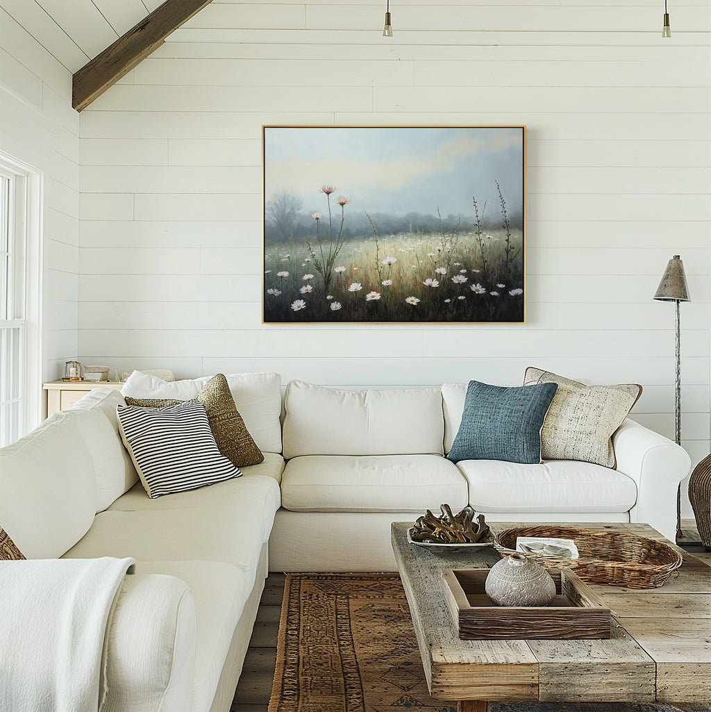 A cozy living room with a white sectional sofa, assorted pillows, a rustic wooden coffee table, and the Dawn Meadow Canvas Art - Horizontal displayed on white shiplap walls.