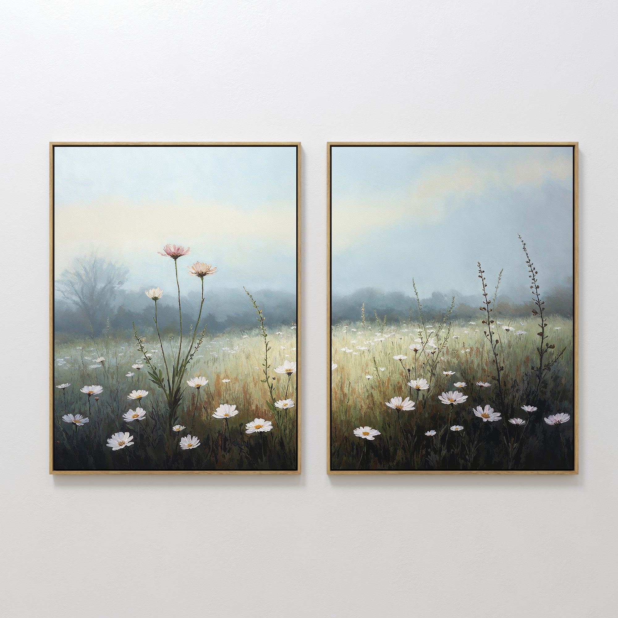The "Dawn Meadow - Set of 2" features framed botanical prints of a wildflower field with white and pink blooms, tall grasses, and a misty backdrop, displayed side by side on a white wall.