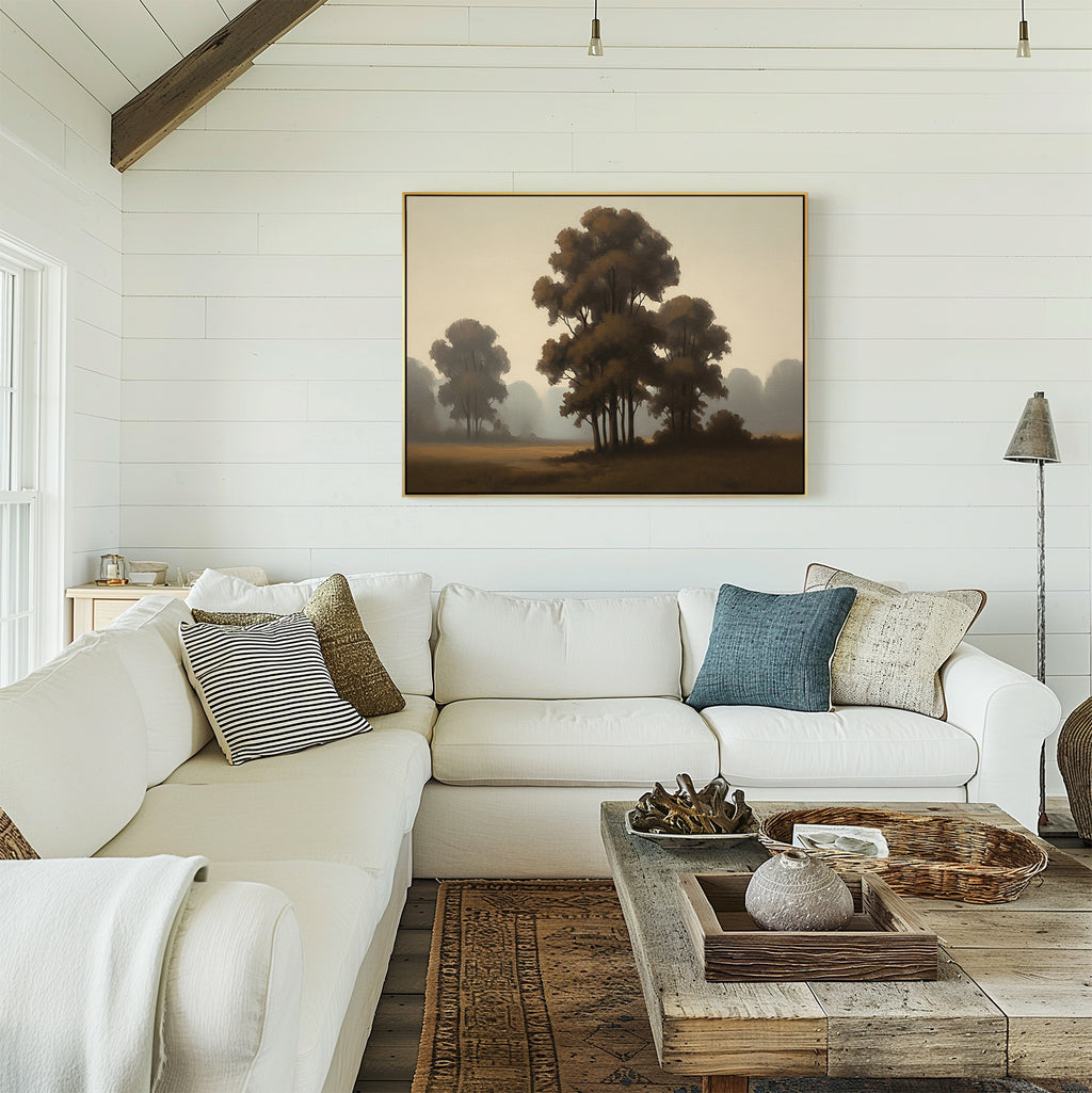 A cozy living room with white shiplap walls, a large white sectional sofa, patterned pillows, a rustic wooden coffee table, woven rugs, and the Dawn Silhouettes Canvas Art - Horizontal featuring trees hanging above the sofa.