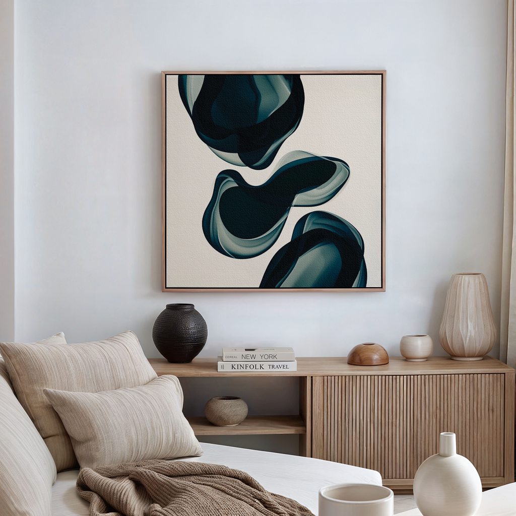 A modern living room features a beige sofa, neutral cushions, and a wooden sideboard with decor. Above it hangs the Deep Sea Hues Abstract Canvas Art by My Store, showcasing dark teal organic shapes for chic style.