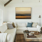 Bright, cozy living room with a white sectional sofa, assorted pillows, rustic wooden coffee table, woven baskets, and the Desert Mirage Canvas Art - Horizontal in earth tones hanging on a white shiplap wall.