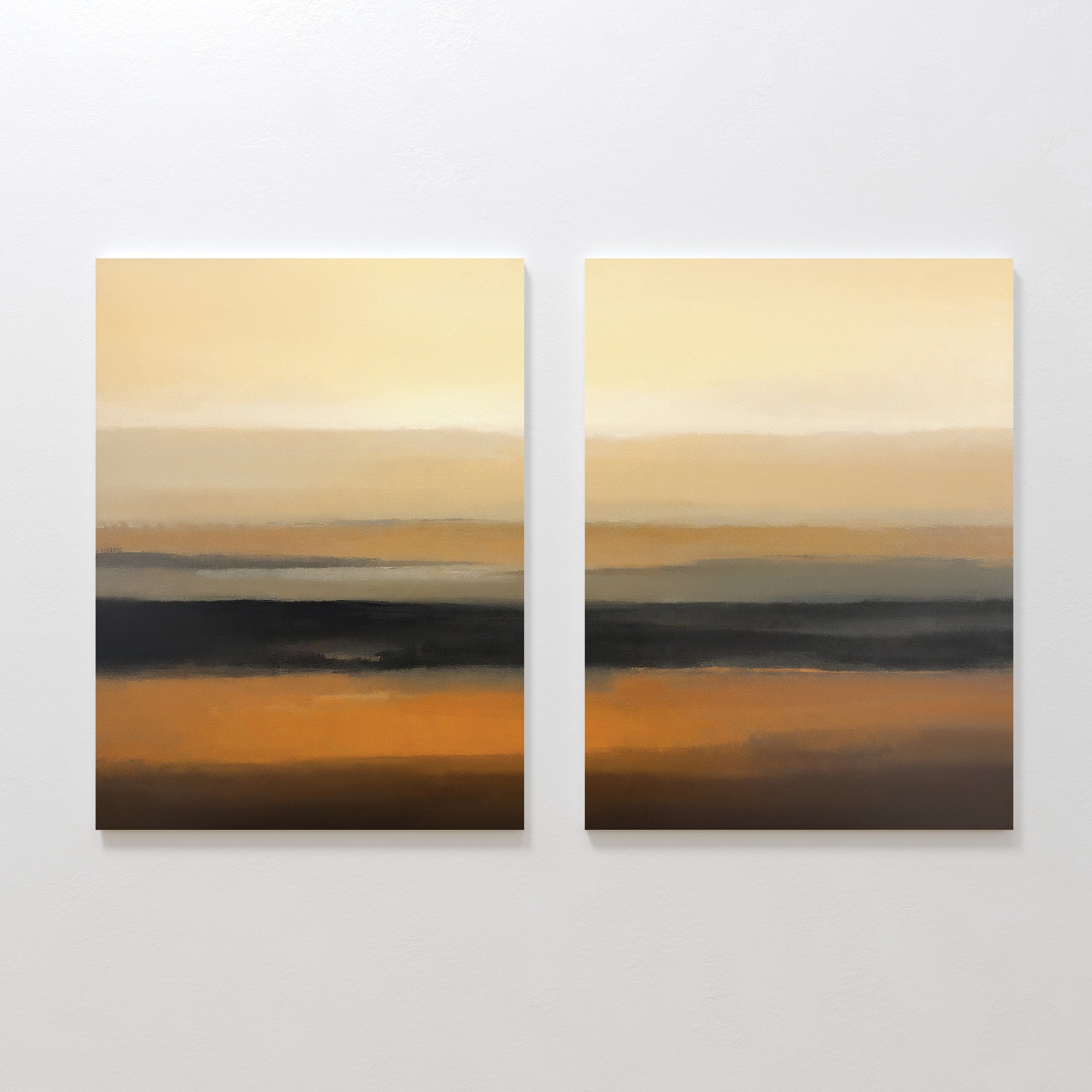 The Desert Mirage - Set Of 2 features abstract prints with horizontal bands in beige, orange, brown, and black earth tones, creating a serene desert landscape vibe against a white wall.