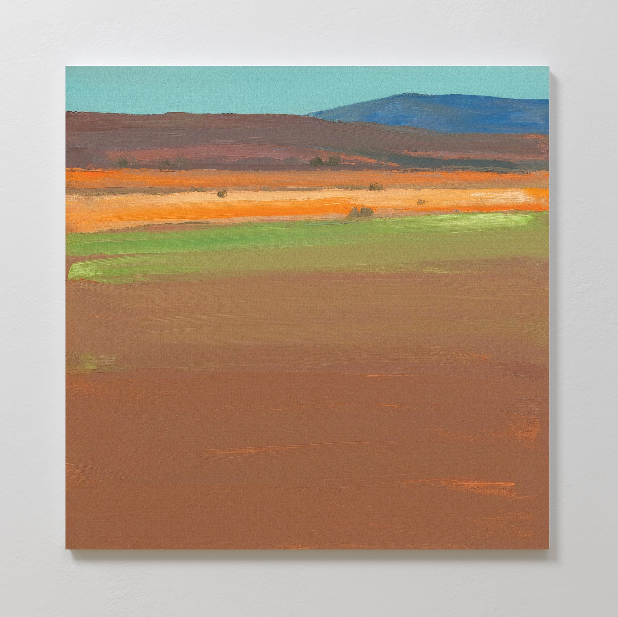 Desert Plains Canvas Art - Square features broad horizontal bands of earthy brown, green, and orange, with blue hills and sky. Ideal southwestern wall art for adding a modern touch to your living room decor.