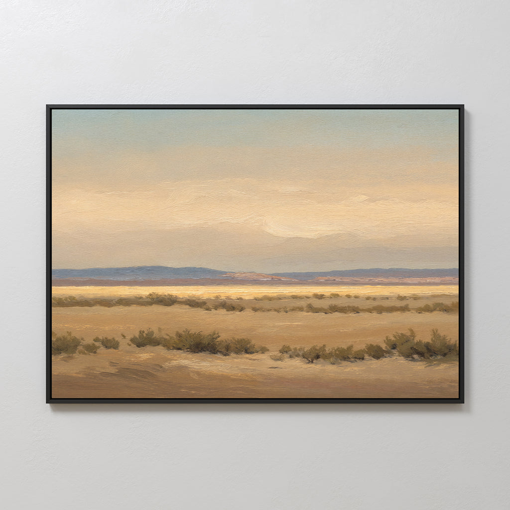 Desert Solitude Canvas Art - Horizontal features a serene desert landscape with sandy ground, sparse bushes, and distant mountains beneath a hazy sky—perfect for adding tranquil decor to any white wall.
