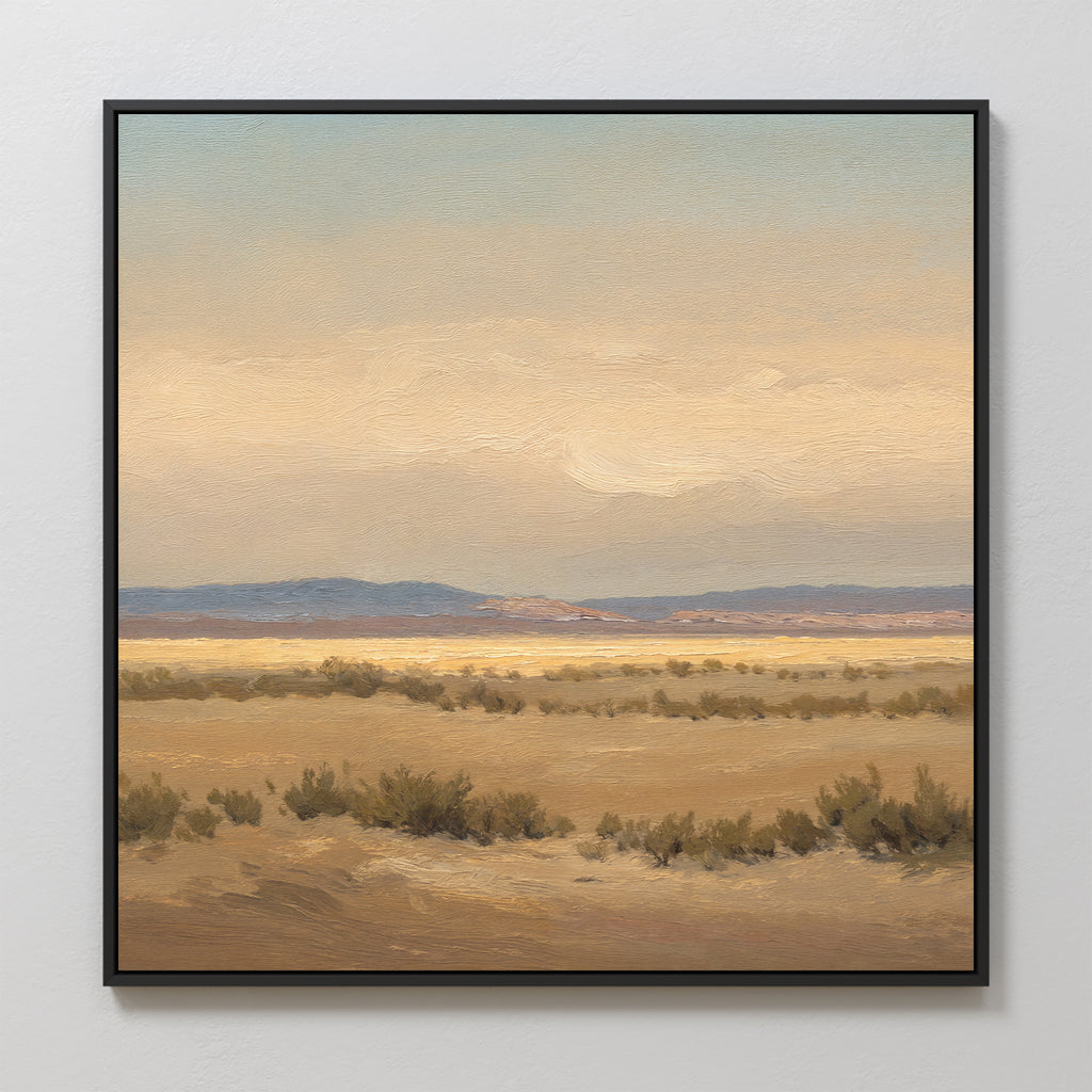 Desert Solitude Canvas Art - Square features an open, arid landscape with dry grasses and low shrubs beneath a soft, cloudy sky in muted earth tones and blues. Distant hills enhance the serene, tranquil vibe—perfect as calming wall decor.