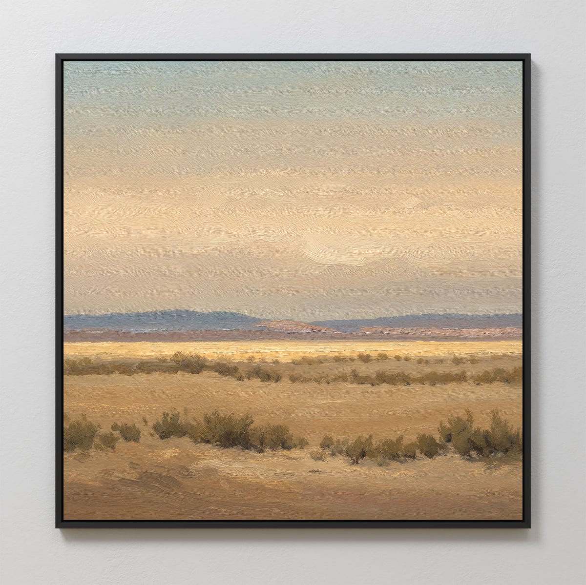 Desert Solitude Canvas Art - Square features an open, arid landscape with dry grasses and low shrubs beneath a soft, cloudy sky in muted earth tones and blues. Distant hills enhance the serene, tranquil vibe—perfect as calming wall decor.