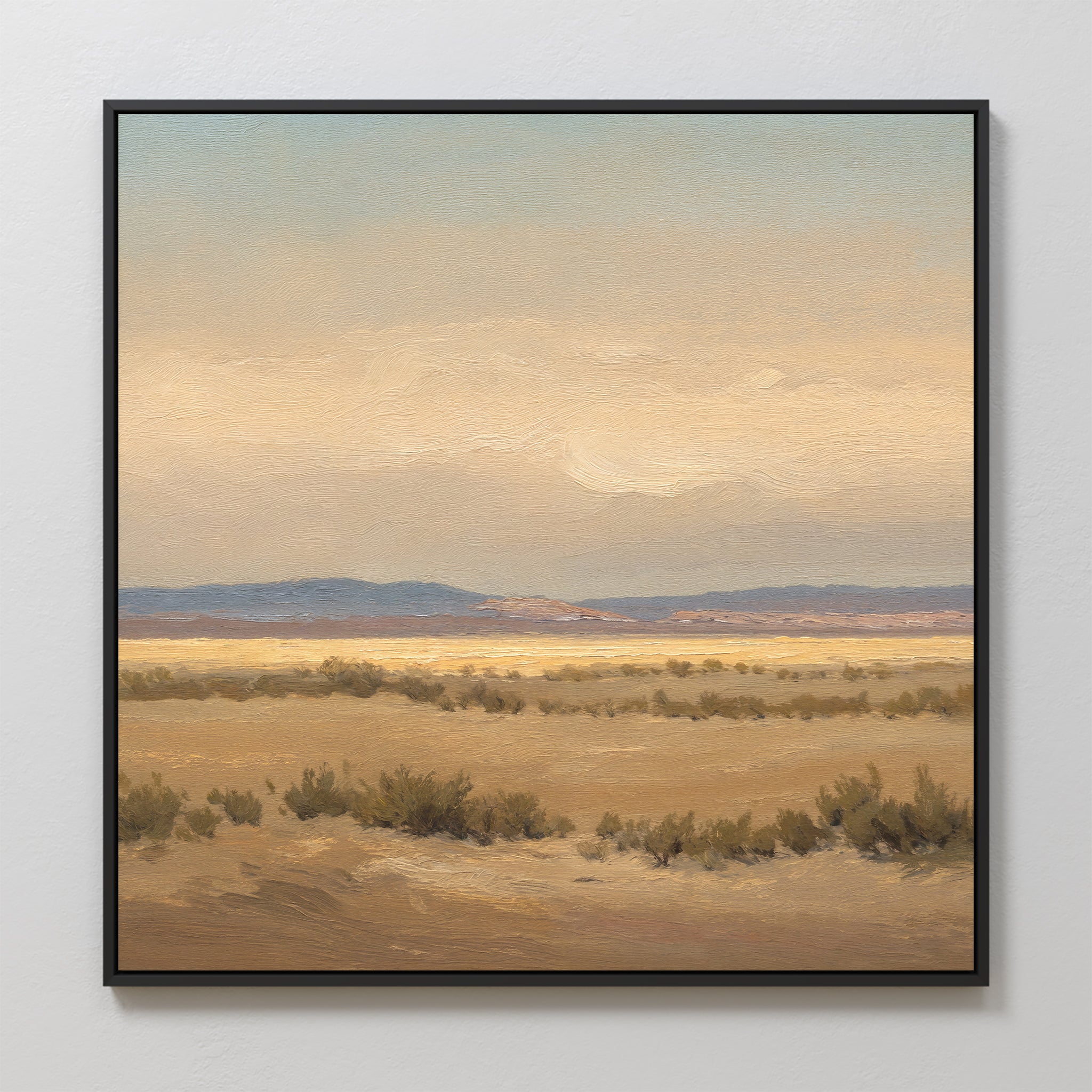 Desert Solitude Canvas Art - Square features an open, arid landscape with dry grasses and low shrubs beneath a soft, cloudy sky in muted earth tones and blues. Distant hills enhance the serene, tranquil vibe—perfect as calming wall decor.