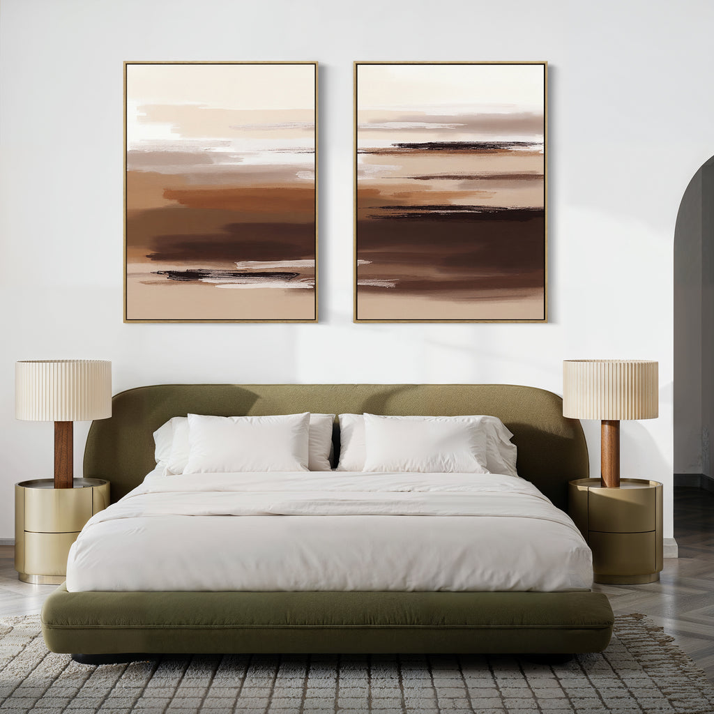 Modern bedroom with an olive green upholstered bed, crisp white bedding, two round gold nightstands, pleated beige lamps, and the Desert Winds - Set Of 2 earth-tone abstract prints in brown and beige hanging above the bed.
