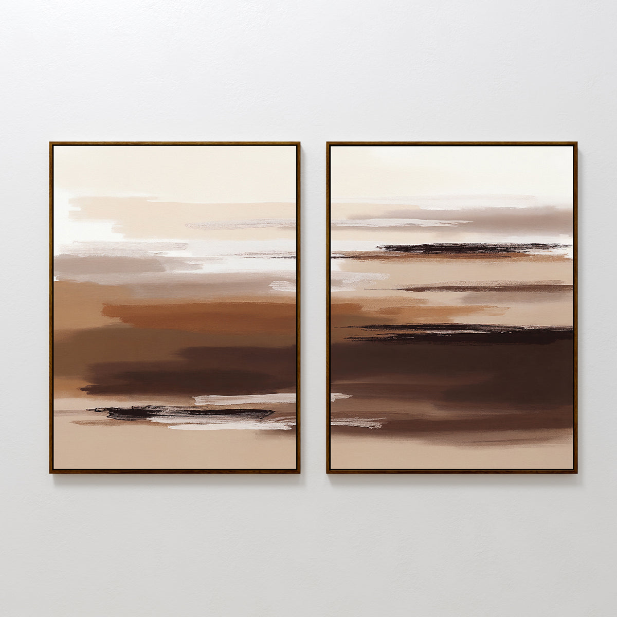 Desert Winds - Set Of 2 features abstract prints with horizontal brushstrokes in brown, beige, and white earth tones. Displayed side by side in frames on a white wall, they create a modern Nordic Park-inspired look.