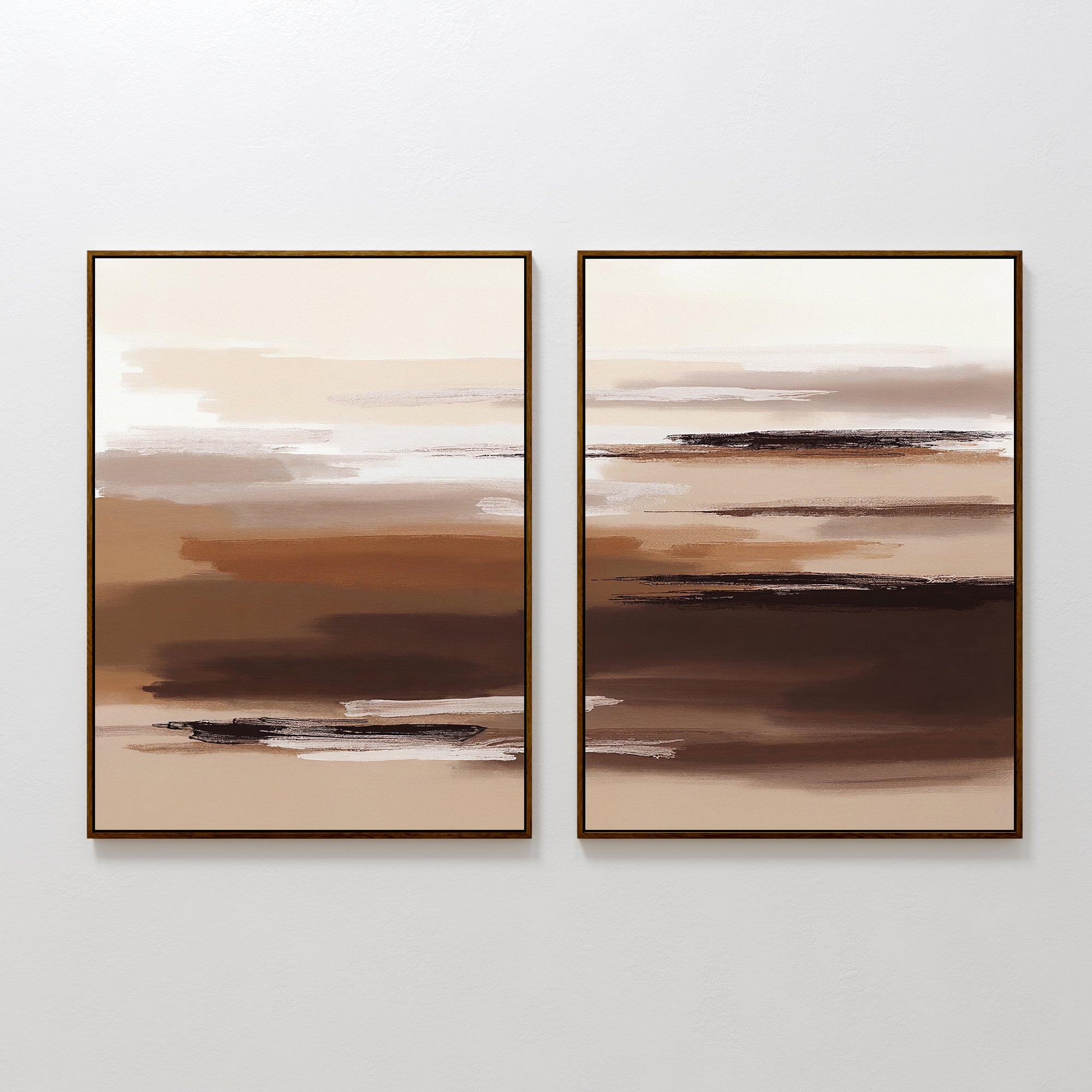 Desert Winds - Set Of 2 features abstract prints with horizontal brushstrokes in brown, beige, and white earth tones. Displayed side by side in frames on a white wall, they create a modern Nordic Park-inspired look.