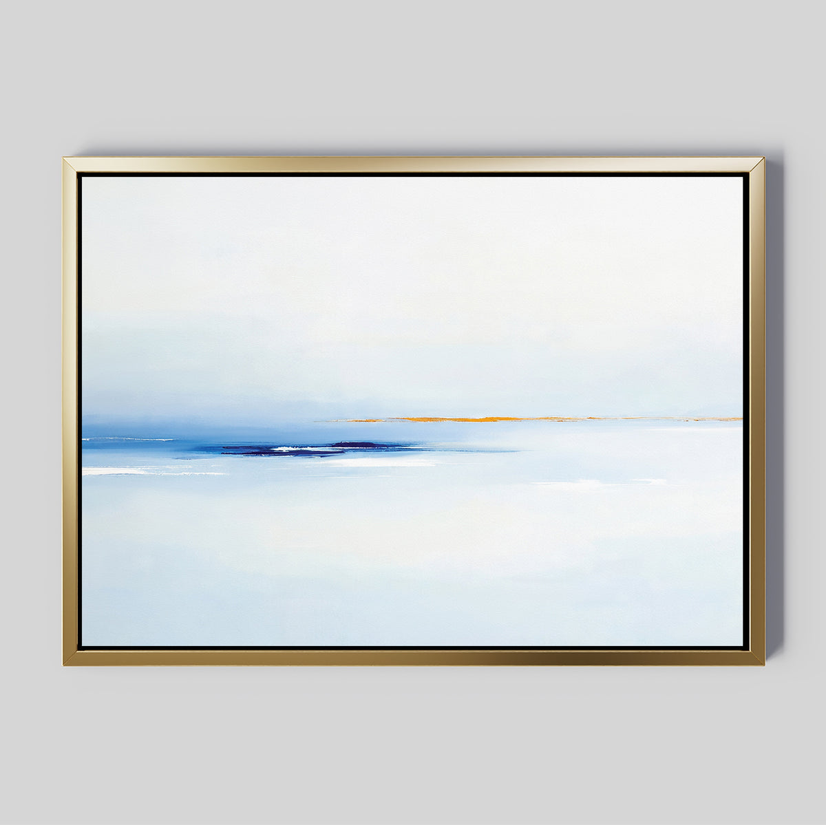 Distant Archipelago Canvas Art - Horizontal: Minimalist gold-framed wall art showcasing a tranquil seascape with light and dark blue water, a thin sandy shore, and soft sky—ideal for contemporary wall decor on a plain gray background.
