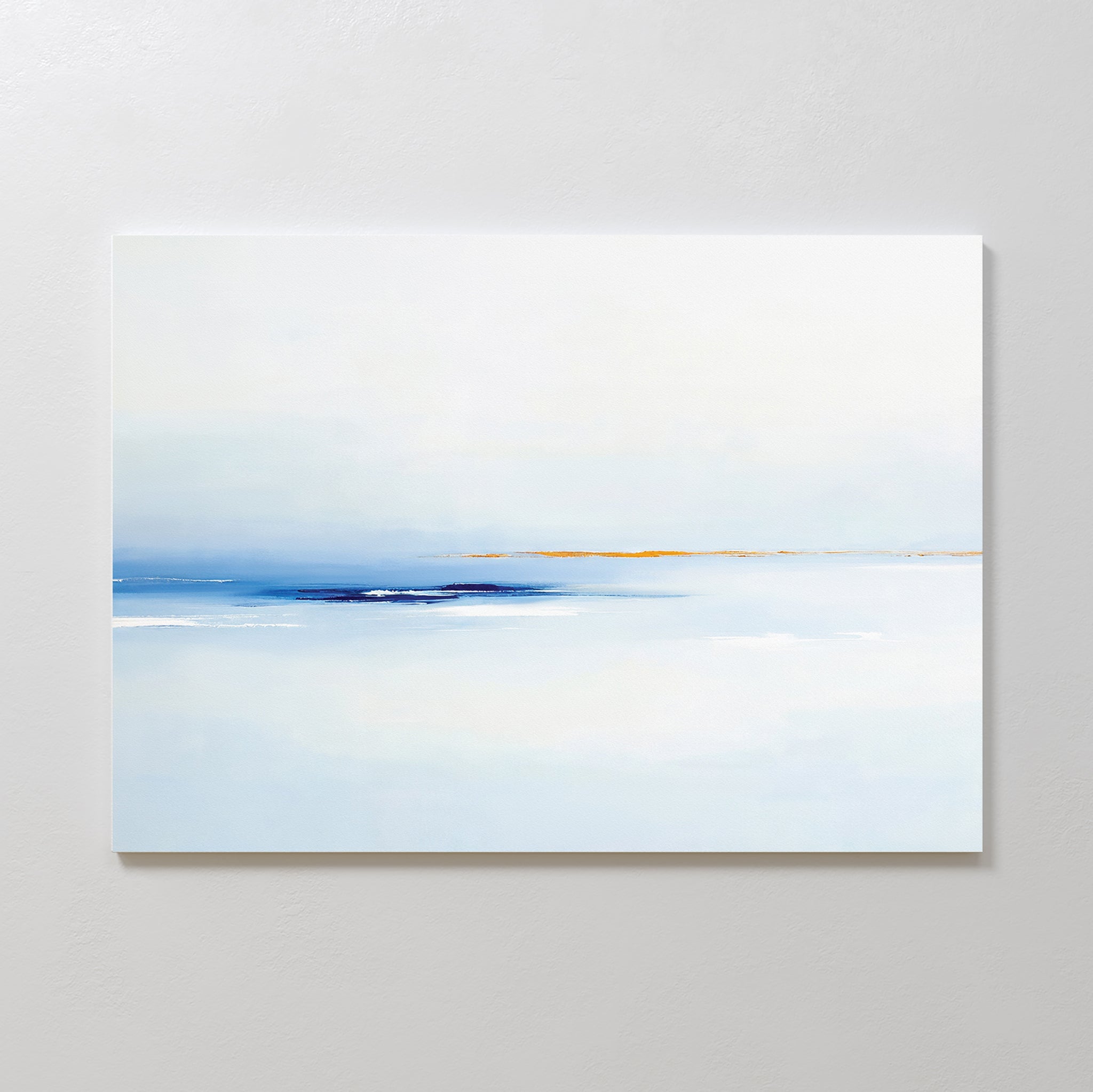 The Distant Archipelago Canvas Art - Horizontal features minimalist wall art in soft light blue and white tones with a thin line of muted yellow and deep blue on the horizon, creating a serene, airy feel ideal for contemporary interiors.