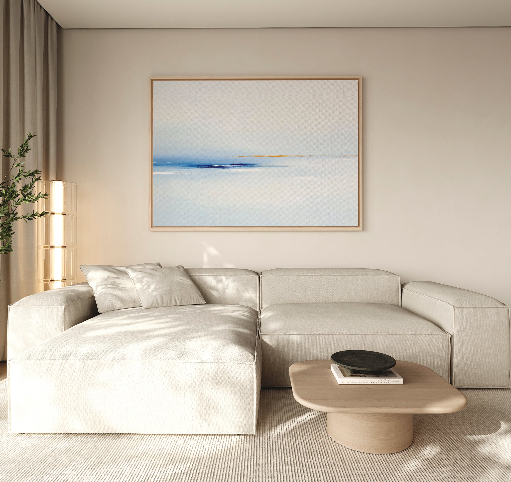 A modern living room with a light beige sectional sofa, a low wooden coffee table with a black bowl, neutral walls, floor-to-ceiling curtains, and Distant Archipelago Canvas Art - Horizontal adding blue and yellow contemporary accents.
