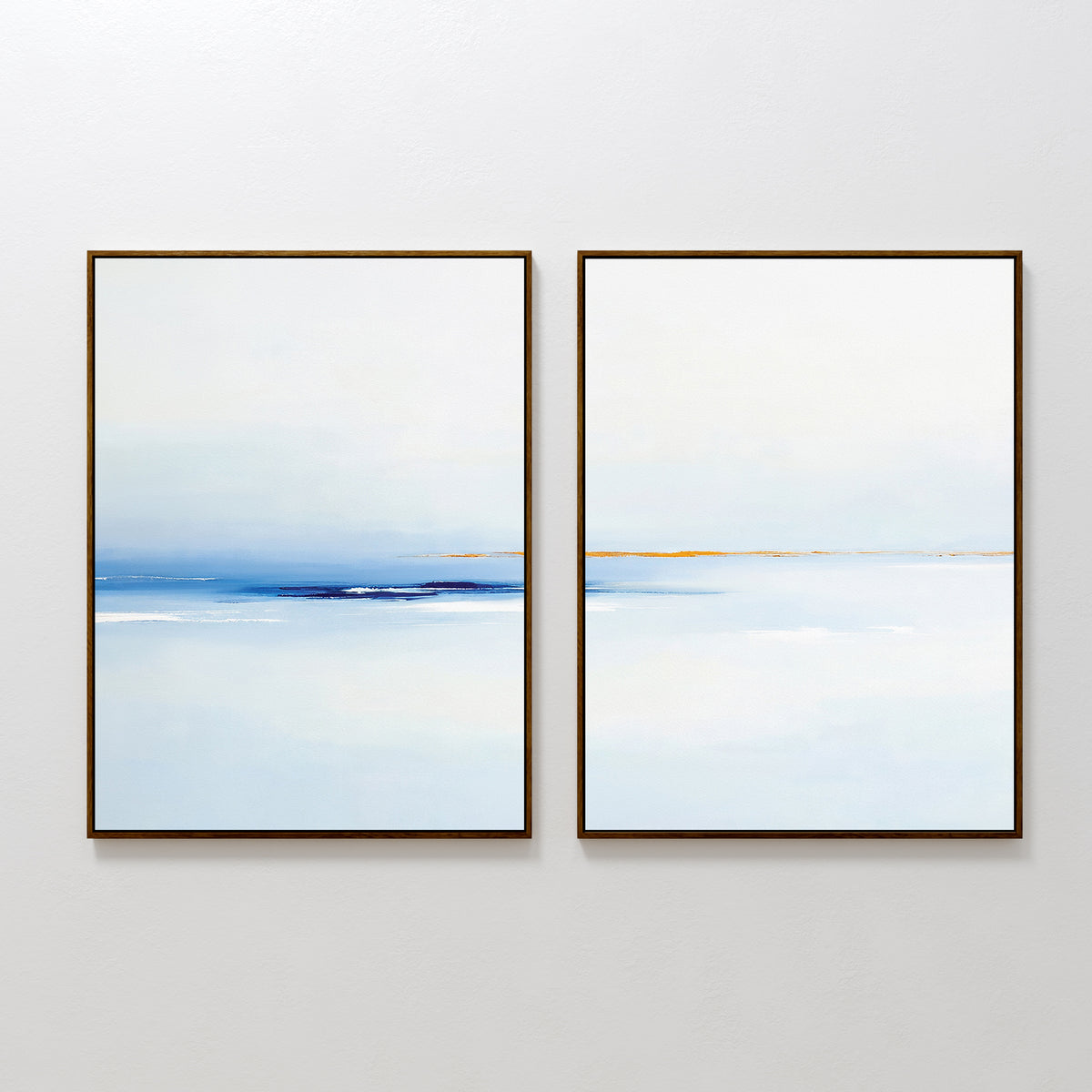The Distant Archipelago - Set Of 2 features abstract, framed prints in soft blue, white, and tan tones side by side—ideal contemporary wall art for minimalist or Nordic Park-inspired interiors seeking a tranquil seascape vibe.