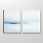 The Distant Archipelago - Set Of 2 features abstract, framed prints in soft blue, white, and tan tones side by side—ideal contemporary wall art for minimalist or Nordic Park-inspired interiors seeking a tranquil seascape vibe.