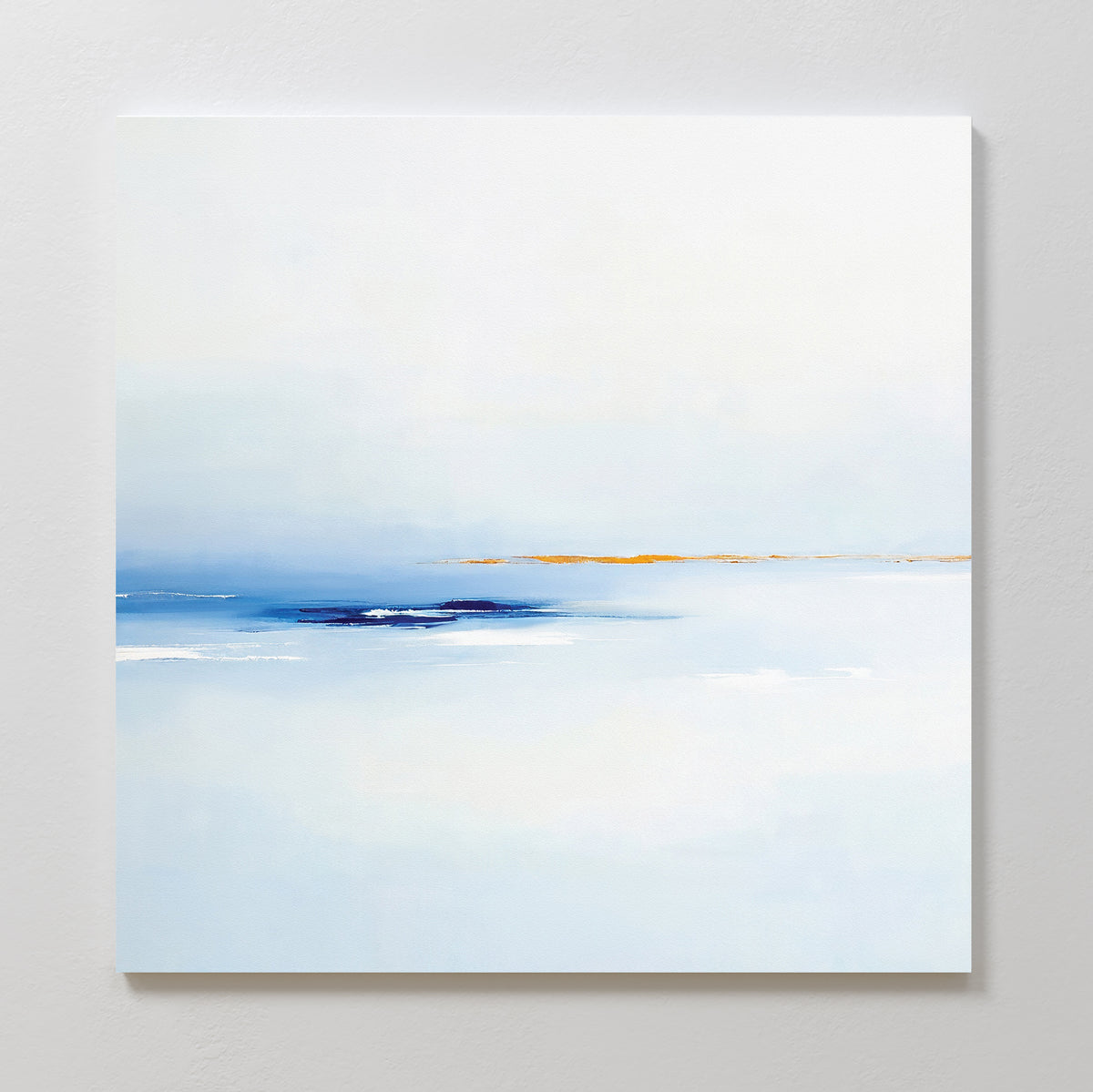The Distant Archipelago Canvas Art - Square showcases a minimalist design with soft blues and whites, accented by a subtle warm beige line near the center, evoking a serene seascape or horizon beneath a gentle sky.