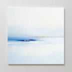 The Distant Archipelago Canvas Art - Square showcases a minimalist design with soft blues and whites, accented by a subtle warm beige line near the center, evoking a serene seascape or horizon beneath a gentle sky.