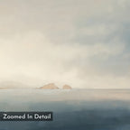The Distant Isles Canvas Art - Horizontal features a serene seascape with distant rocky islands, a cloudy sky, and calm water reflecting soft pastel hues. "Zoomed In Detail" appears in the bottom left corner.