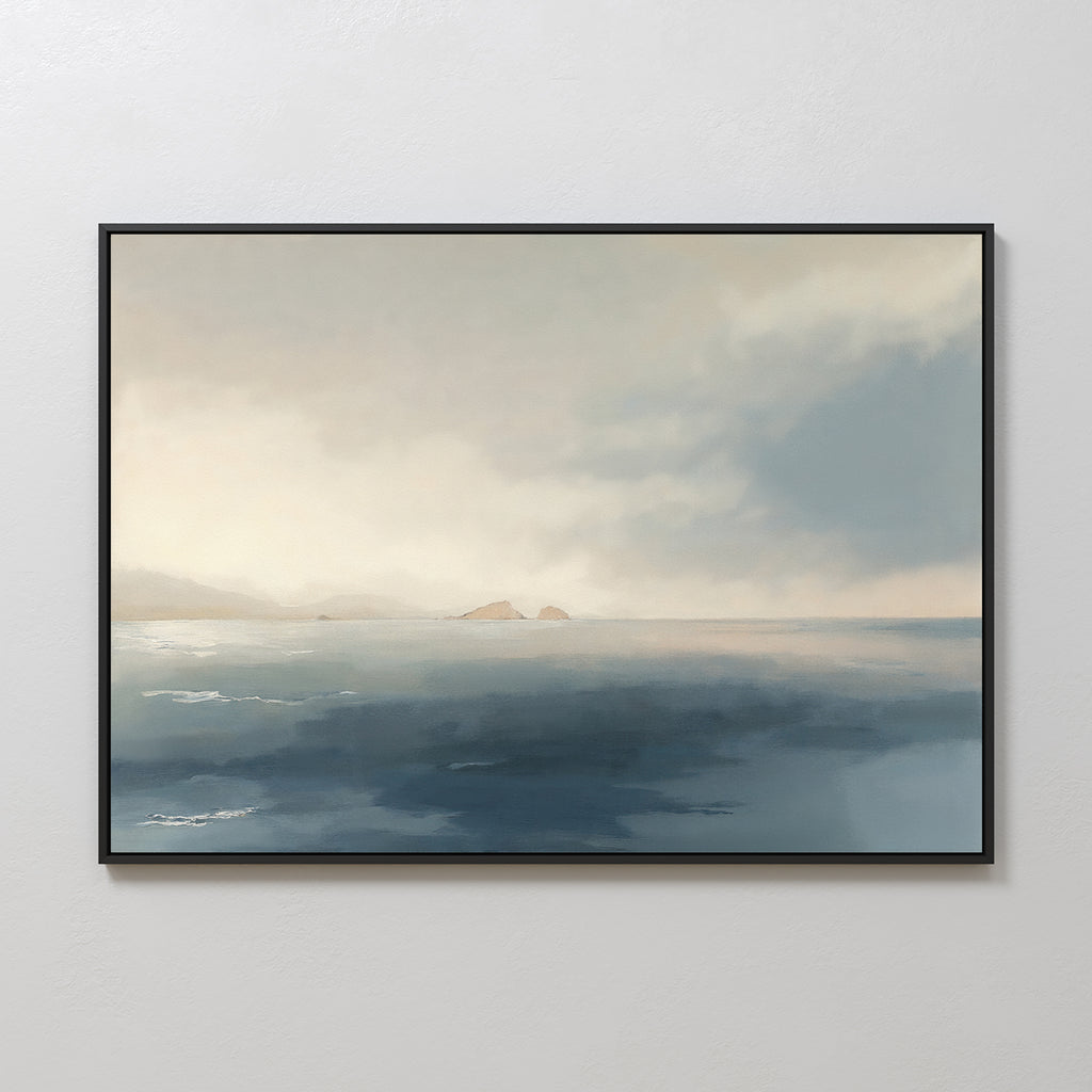 The Distant Isles Canvas Art - Horizontal displays a calm sea and distant mountains under a cloudy sky in soft blue and beige tones, creating a minimalist seascape perfect for tranquil home decor on light-colored walls.