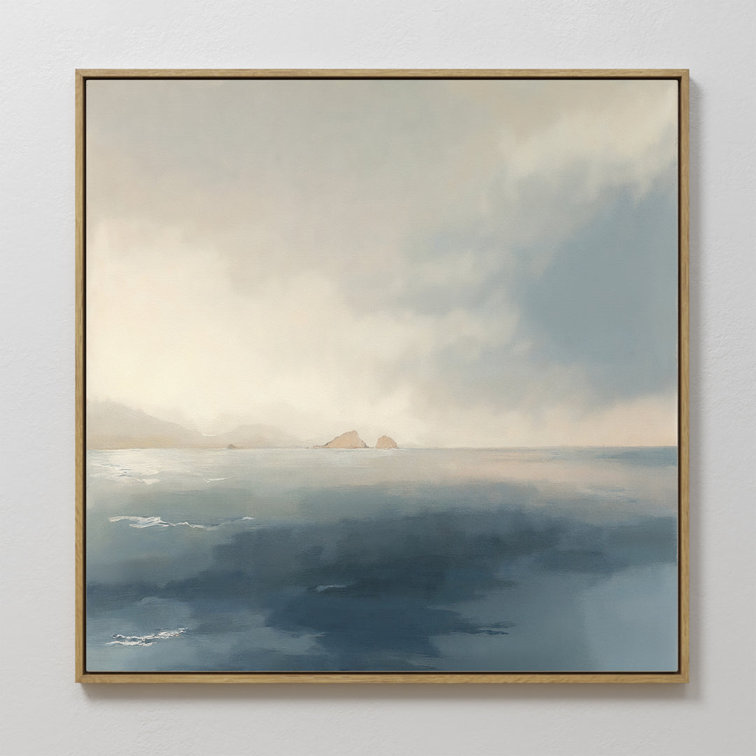 The Distant Isles Canvas Art - Square features a calm seascape with soft blue water, distant rocky islands, and a hazy sky, bringing a serene and peaceful atmosphere to any space.