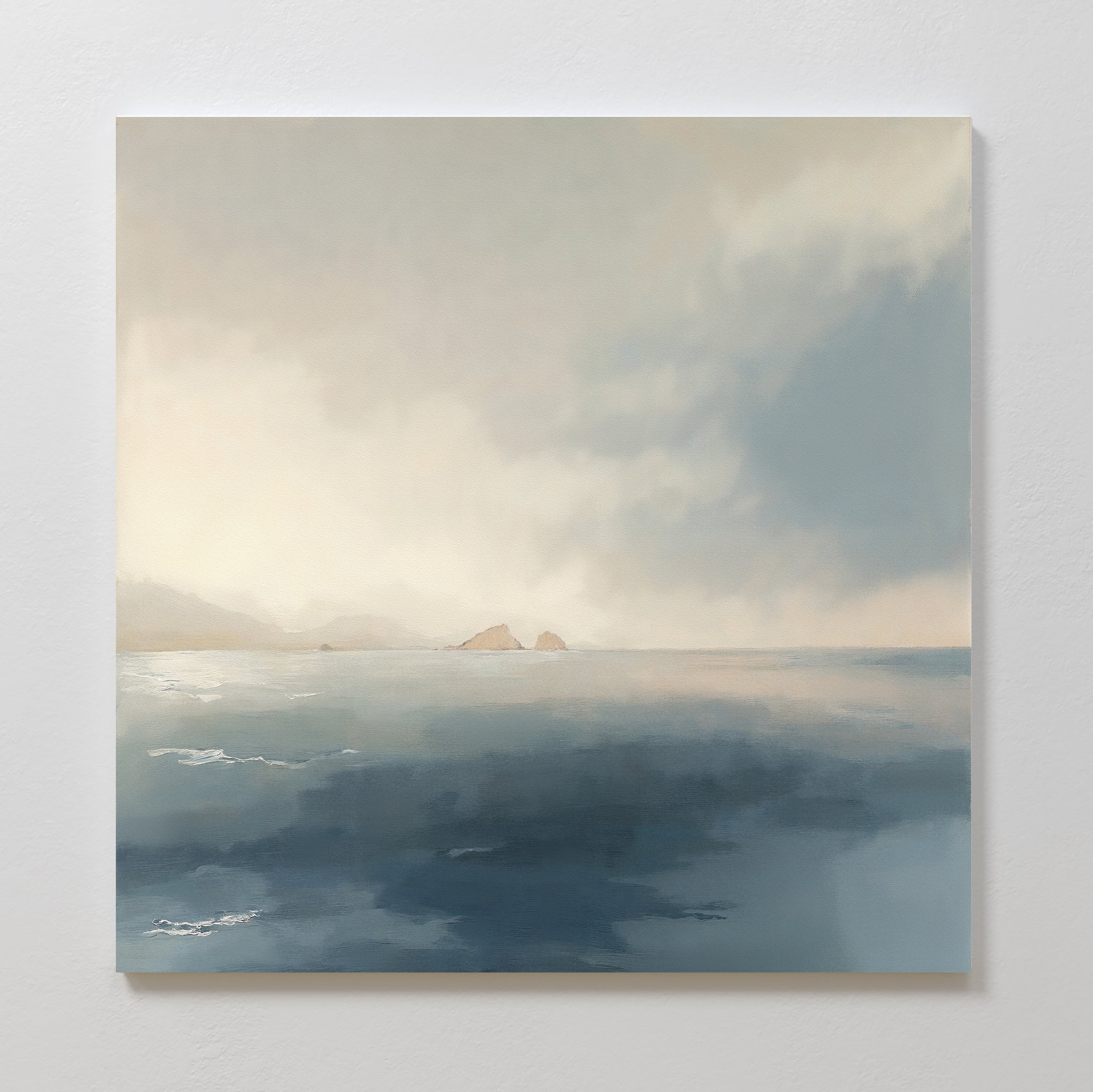 Bring calm to your space with the Distant Isles Canvas Art - Square, featuring a tranquil seascape of soft light, distant rocky islands, and serene blue-gray reflections beneath a cloudy sky. Perfect as soothing wall art for any room.