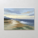 Experience tranquility with the Distant Shores Canvas Art - Horizontal, featuring a calm beach at sunrise or sunset, soft waves, sandy shore, distant mountains, and a cloudy sky bathed in gentle light.