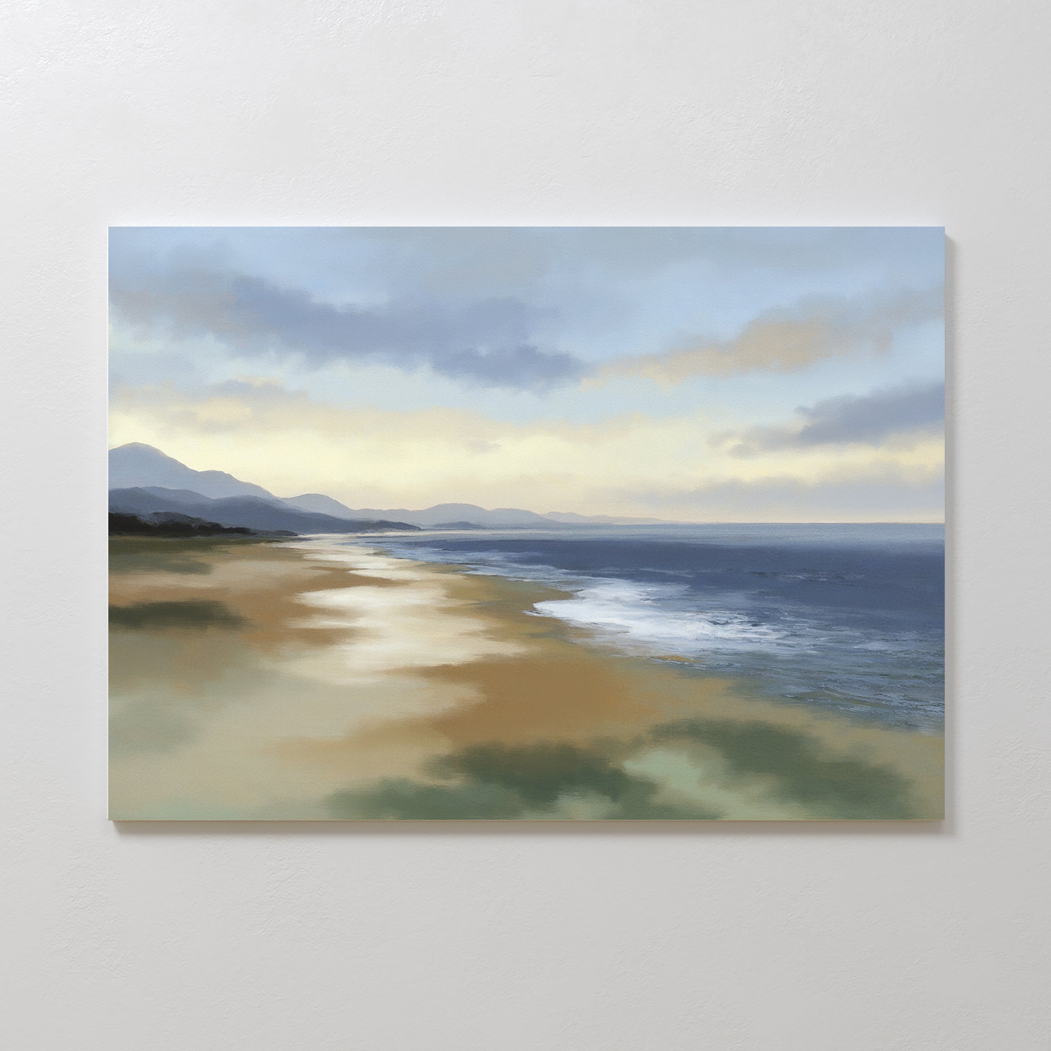 Experience tranquility with the Distant Shores Canvas Art - Horizontal, featuring a calm beach at sunrise or sunset, soft waves, sandy shore, distant mountains, and a cloudy sky bathed in gentle light.