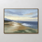 The Distant Shores Canvas Art - Horizontal captures a tranquil beach with soft waves, reflective sand, and distant mountains under a calm, cloudy sky—an ideal serene landscape for peaceful decor.