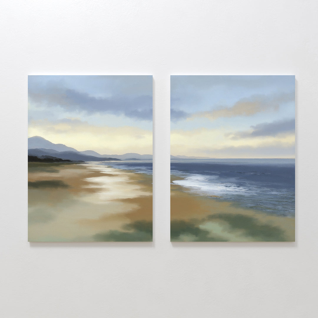 The Distant Shores - Set of 2 showcases a serene coastal panorama with sandy shores, gentle waves, distant hills, and a soft sky in tranquil blues and golds—perfect for adding calm to any space.
