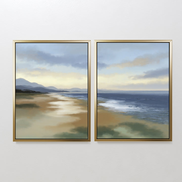 The Distant Shores - Set of 2 features framed landscape paintings side by side, showcasing a tranquil coastal view with mountains, sandy shore, and calm sea beneath a cloudy sky for a peaceful, natural touch.