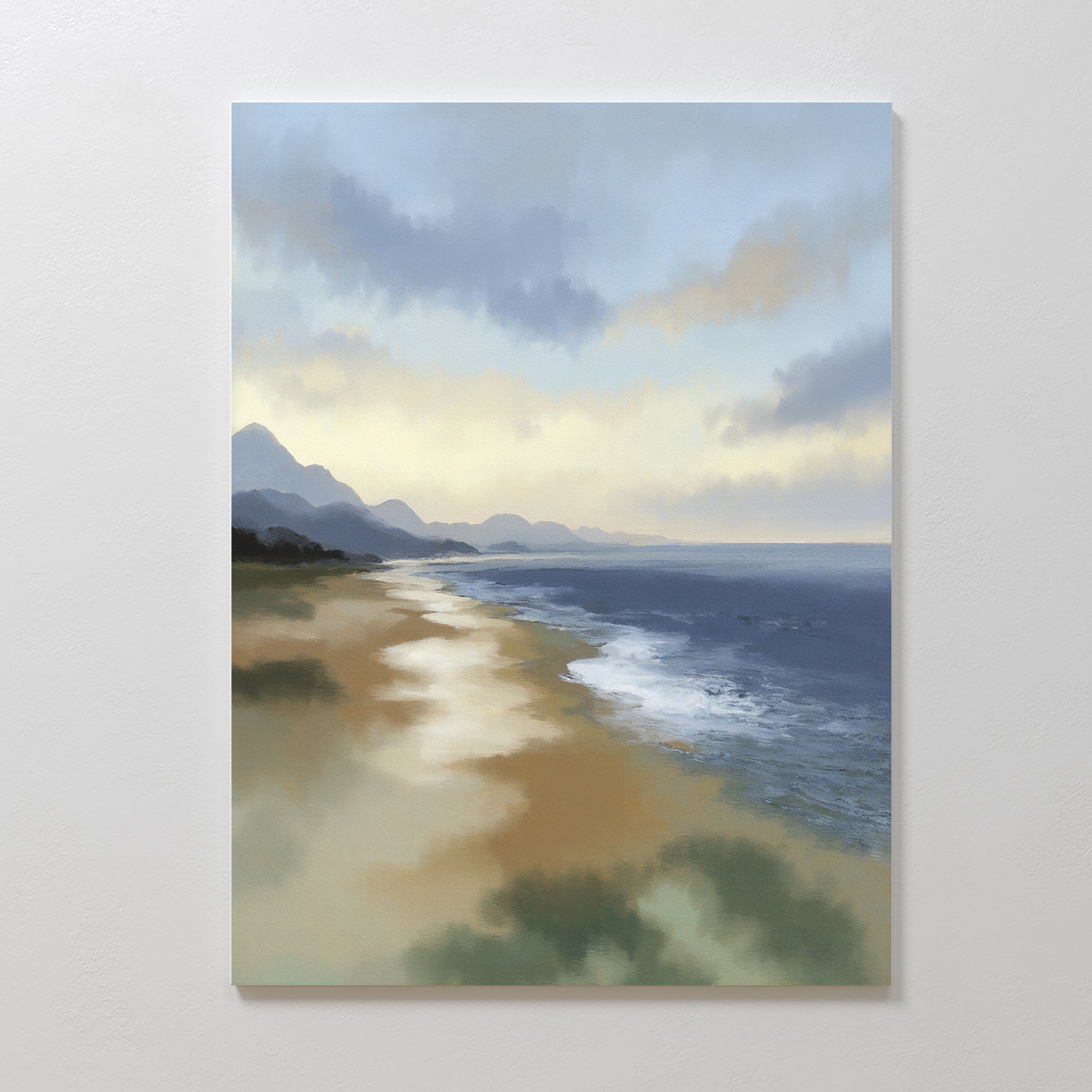 Distant Shores Canvas Art - Vertical depicts waves softly washing onto a sandy shore, with distant mountains to the left and a cloudy sky that bathes the peaceful landscape in gentle light.