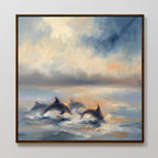 Bring serene beauty to your space with the Dolphin Pod at Sunset Canvas Art - Square, featuring dolphins leaping through ocean waves under a colorful sky, painted in soft impressionistic style for tranquil wall art appeal.