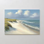 The Dune Whispers Canvas Art - Horizontal features a serene beach with rolling waves, white sand, grassy dunes on the left, and a partly cloudy sky—creating a calming coastal scene perfect for display on a white wall.