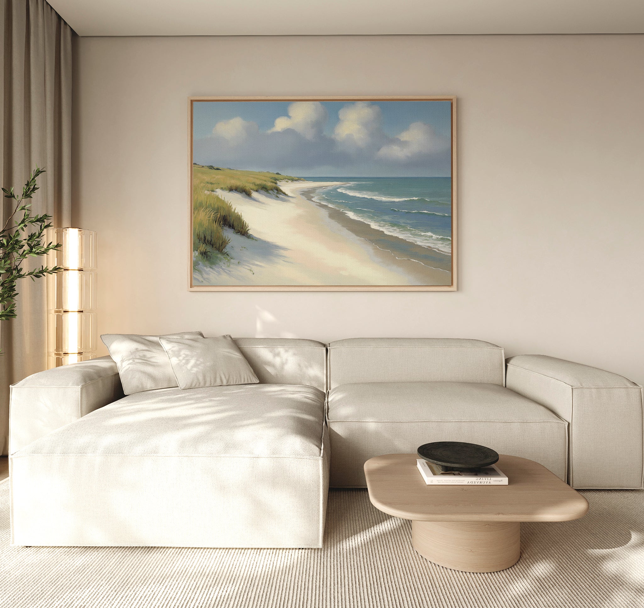 A modern living room features a light beige sectional sofa, a wooden coffee table, a potted plant, and the Dune Whispers Canvas Art - Horizontal above the sofa. Natural light fills the minimalist space, emphasizing the serene coastal artwork.