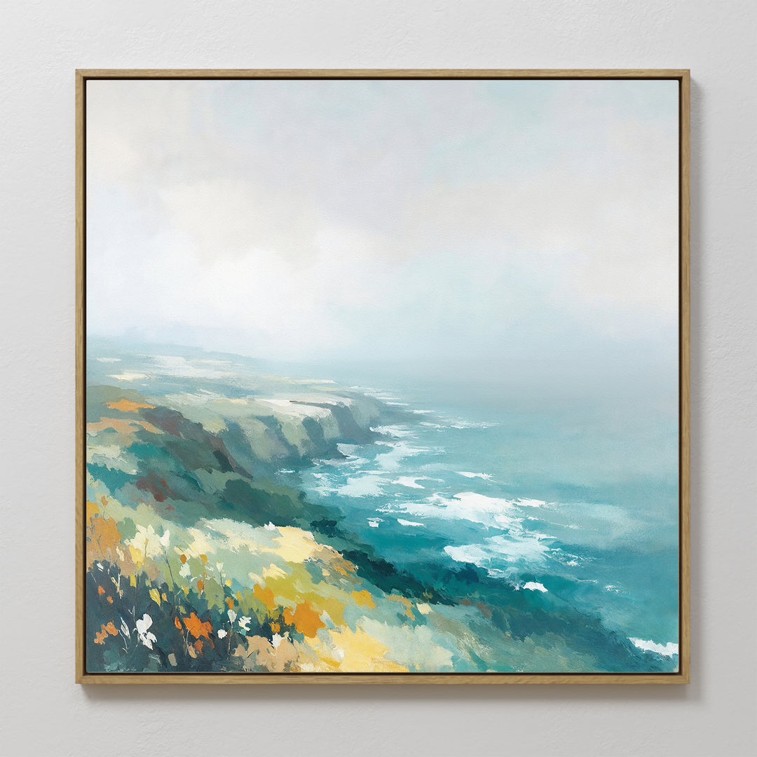The Emerald Cliffs Canvas Art - Square features a framed coastal landscape with wildflowers and ocean waves beneath a misty sky, painted in soft blue, green, yellow, and white brushstrokes.