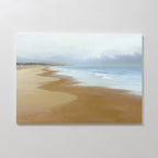 The Endless Shoreline Canvas Art - Horizontal features a calm beach with gentle waves, soft sand, and a cloudy sky on a light wall—ideal as coastal decor to create a tranquil, relaxing atmosphere in your space.