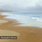 Endless Shoreline Canvas Art - Horizontal features a sandy beach with gentle waves and a cloudy sky. The distant coastline is softened by mist, adding serenity. “Zoomed In Detail” appears in the bottom left corner of this wall art.
